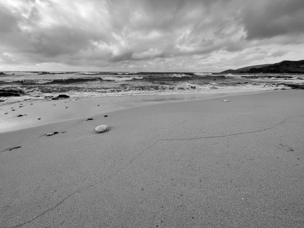 Sandy beach cloudy day.